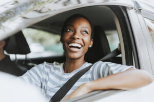 Cheerful woman in a car